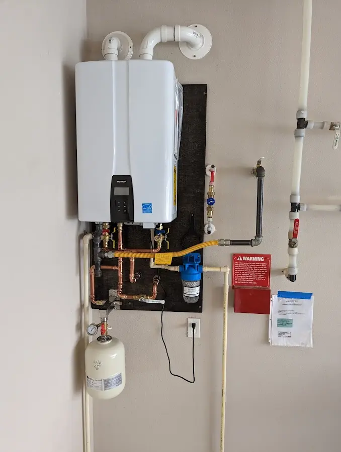Professional plumber installing copper piping in a White Bluff home